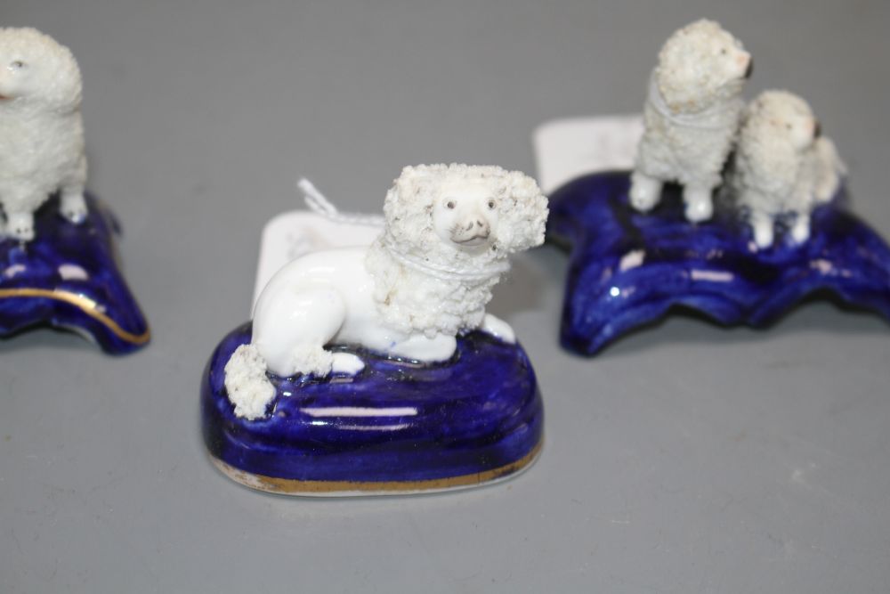 Five Staffordshire porcelain toy groups of poodles, c. 1840-50, the majority by Dudson, H. 4.2 - 5.2cm